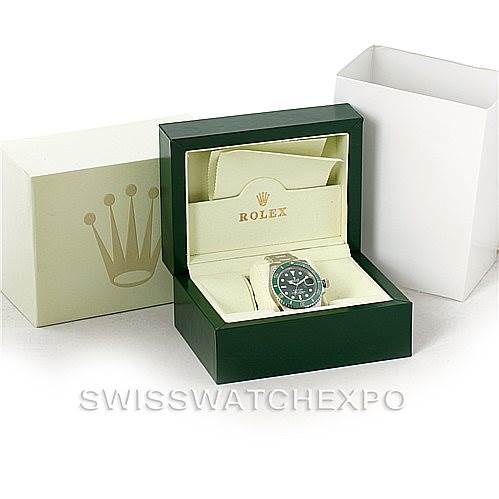 The image shows a Rolex Submariner 116610LV Men
s Stainless Steel Green Dial 116610LV Men
s Stainless Steel Green Dial watch in its green box, along with the outer packaging that includes a white and yellow-gold box.