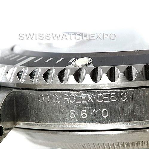 The image shows a close-up side view of a Rolex Submariner 16610 Men
s Stainless Steel Black Dial 16610 Men
s Stainless Steel Black Dial
s bezel and case, displaying the engraving "ORIG. ROLEX DESIGN 16610."