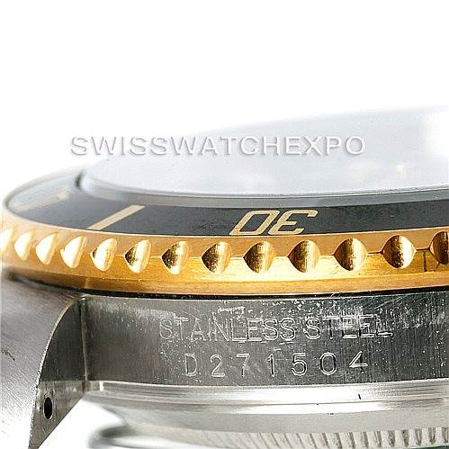 The image shows a close-up side view of the Rolex Submariner 16613 Men's Steel and Gold (two tone) Black Dial 16613 Men's Steel and Gold (two tone) Black Dial watch, focusing on the bezel and part of the stainless steel case with engravings.