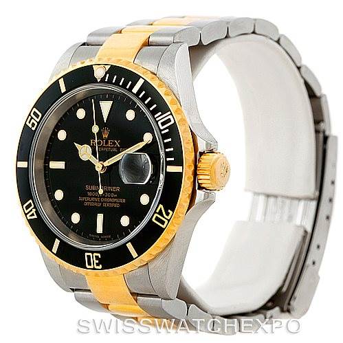 The image shows a Rolex Submariner 16613 Men's Steel and Gold (two tone) Black Dial 16613 Men's Steel and Gold (two tone) Black Dial watch angled to display its face, case, bezel, and part of the bracelet.