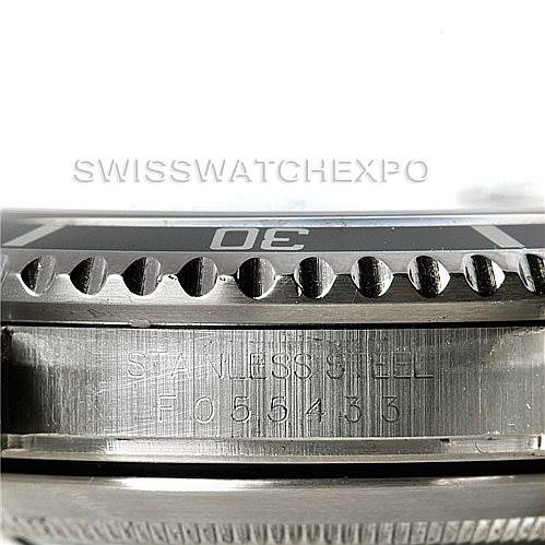 This image shows a close-up of the bezel and the case edge of a Rolex Submariner 16610 Men
s Stainless Steel Black Dial 16610 Men
s Stainless Steel Black Dial, highlighting the serial number and material (stainless steel).