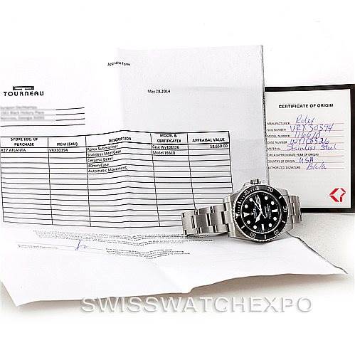 The image shows a Rolex Submariner 116610 Men
s Stainless Steel Black Dial 116610 Men
s Stainless Steel Black Dial watch positioned on top of certification documents, with the dial and bracelet clearly visible.