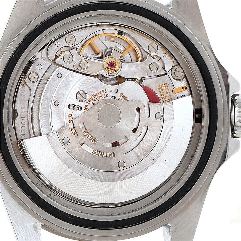 The image shows the movement and inner mechanism of a Rolex Submariner 14060 Men
s Stainless Steel Black Dial 14060 Men
s Stainless Steel Black Dial watch from the back.