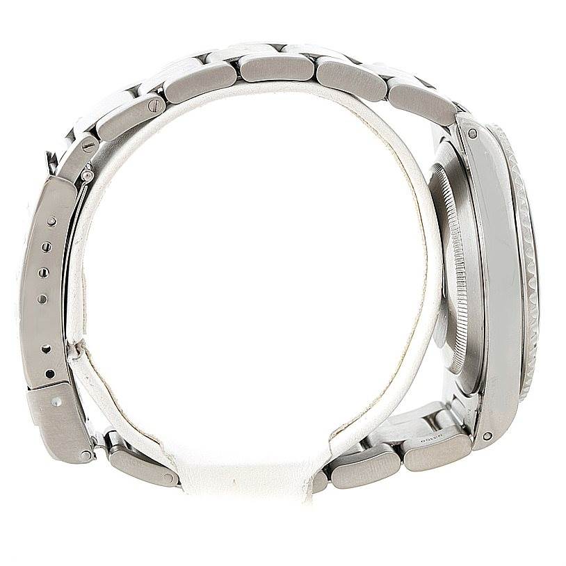 The image shows a side profile of a Rolex Submariner 14060 Men
s Stainless Steel Black Dial 14060 Men
s Stainless Steel Black Dial watch, highlighting the case, bezel, and bracelet links.