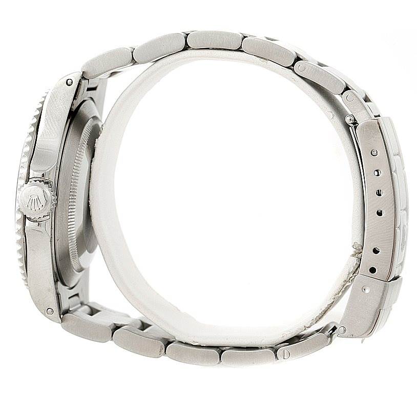 This image shows a side view of a Rolex Submariner 14060 Men
s Stainless Steel Black Dial 14060 Men
s Stainless Steel Black Dial watch, highlighting the crown and bracelet links.