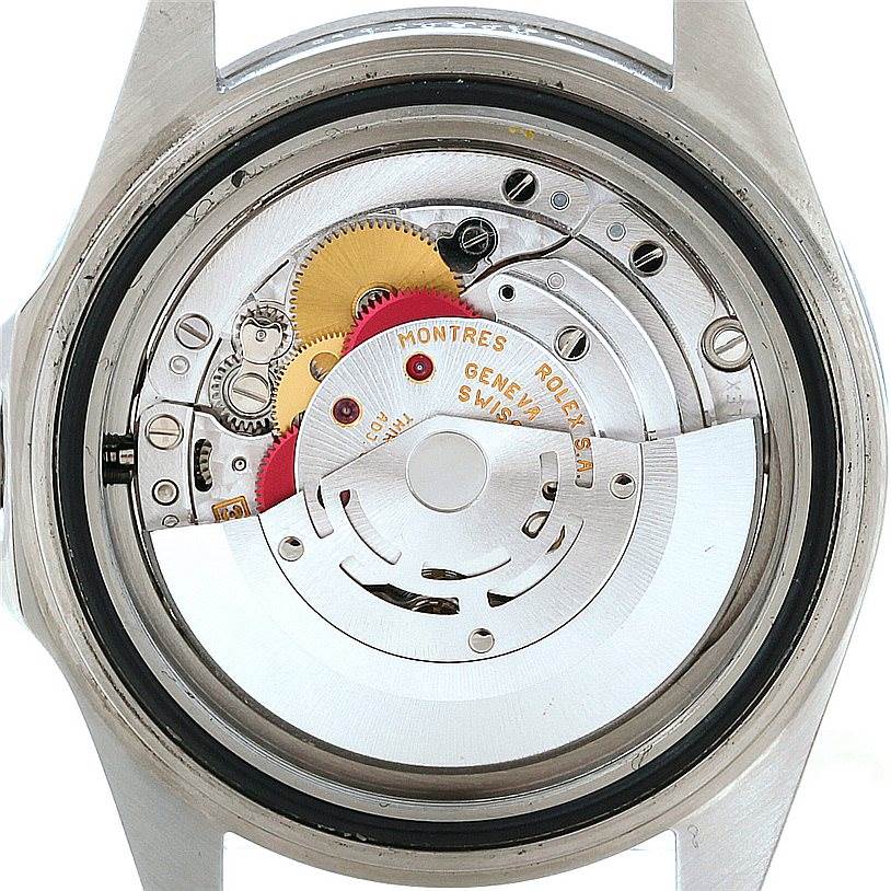 This image shows the back view of a Rolex Submariner 14060 Men
s Stainless Steel Black Dial 14060 Men
s Stainless Steel Black Dial watch, highlighting its internal mechanical movement parts.