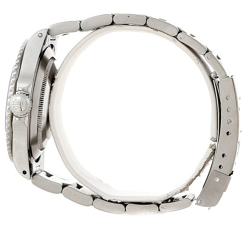 The image shows a side view of the Rolex Submariner 14060 Men
s Stainless Steel Black Dial 14060 Men
s Stainless Steel Black Dial model watch, highlighting its crown and bracelet.