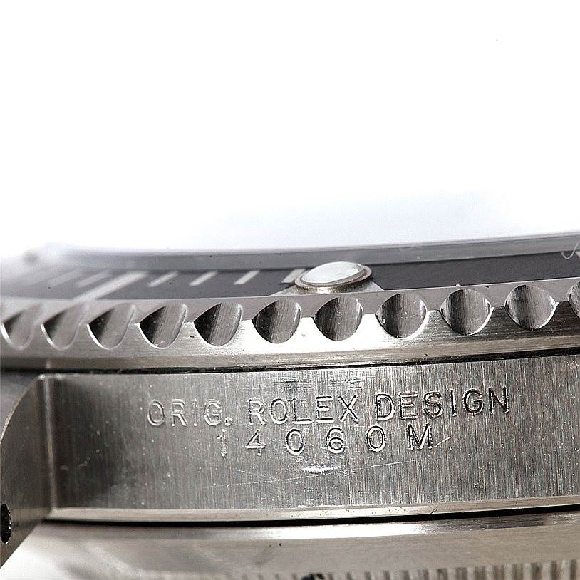 This image shows a close-up of the bezel and side of a Rolex Submariner 14060 Men
s Stainless Steel Black Dial 14060 Men
s Stainless Steel Black Dial watch, highlighting the design engraving.