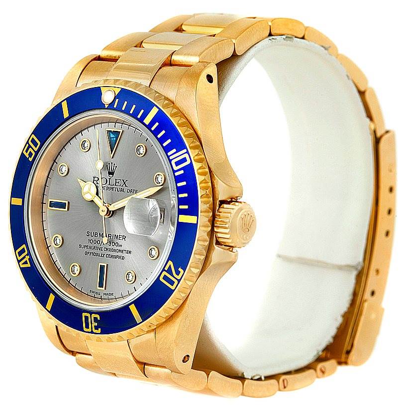 The image shows a side angle view of a Rolex Submariner 16618 Men's Yellow Gold Grey Dial 16618 Men's Yellow Gold Grey Dial watch, highlighting the bezel, dial, crown, and bracelet.