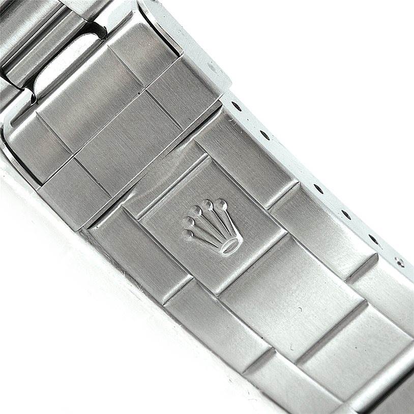 This image shows a close-up of the clasp on the metal bracelet of a Rolex Submariner 14060 Men
s Stainless Steel Black Dial 14060 Men
s Stainless Steel Black Dial watch.