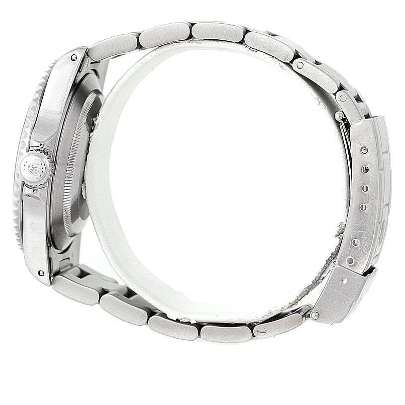 The image shows a side view of the Rolex Submariner 14060 Men
s Stainless Steel Black Dial 14060 Men
s Stainless Steel Black Dial, highlighting its bracelet, clasp, and partially the crown.