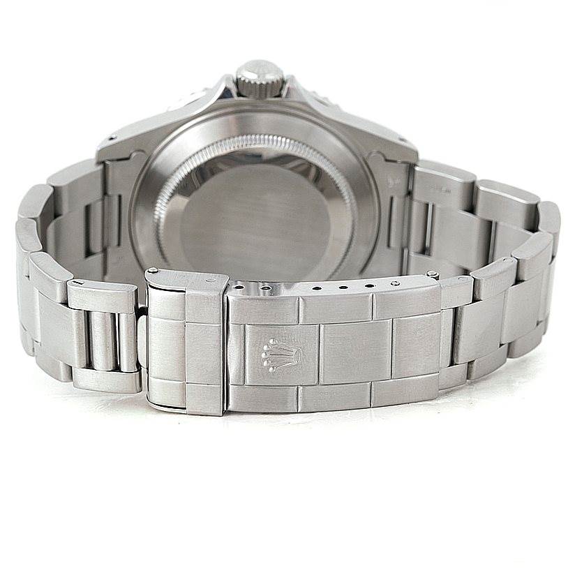 The image shows the back view of a Rolex Submariner 14060 Men
s Stainless Steel Black Dial 14060 Men
s Stainless Steel Black Dial, highlighting its metal bracelet and closed clasp.