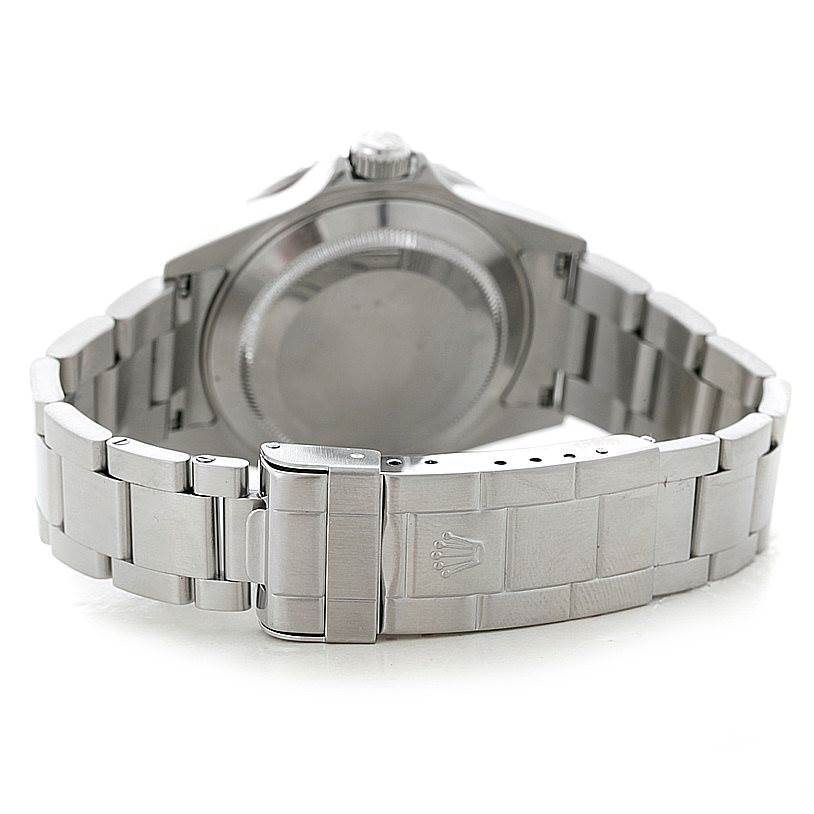 This is a rear view of a Rolex Submariner 16610 Men
s Stainless Steel Black Dial 16610 Men
s Stainless Steel Black Dial showing the case back and metal bracelet clasp.