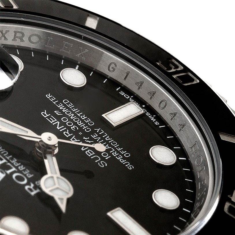 This image shows a close-up angle of the Rolex Submariner 116610 Men
s Stainless Steel Black Dial 116610 Men
s Stainless Steel Black Dial dial and bezel, highlighting the model details and part of the serial number.