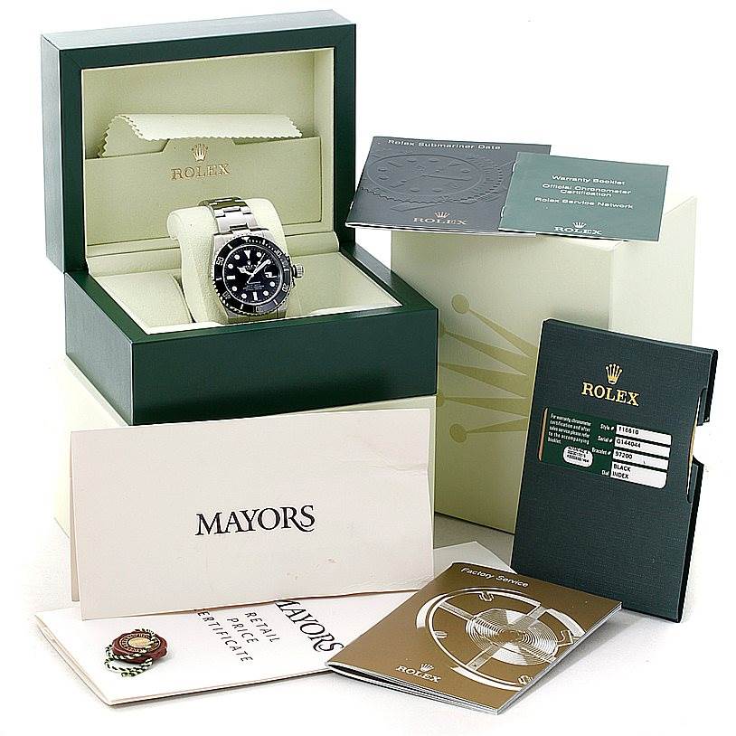 The image shows a Rolex Submariner 116610 Men
s Stainless Steel Black Dial 116610 Men
s Stainless Steel Black Dial watch in its box, along with booklets, warranty card, and other accessories from various angles.