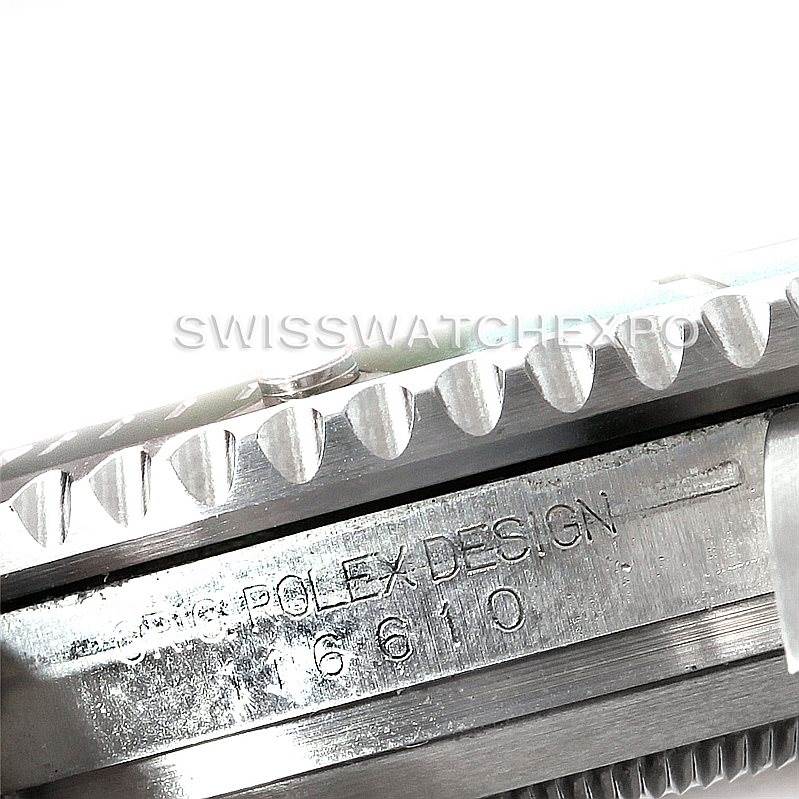 The image shows a close-up angle of the Rolex Submariner 116610LV Men's Stainless Steel Green Dial 116610LV Men's Stainless Steel Green Dial's bezel and engraved case side, highlighting "ROLEX DESIGN 16610".