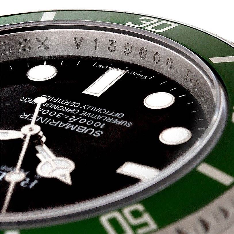 The image shows a close-up angle of the Rolex Submariner 16610 Men
s Stainless Steel Black Dial 16610 Men
s Stainless Steel Black Dial
s bezel and dial, focusing on the model details and part of the watch face.