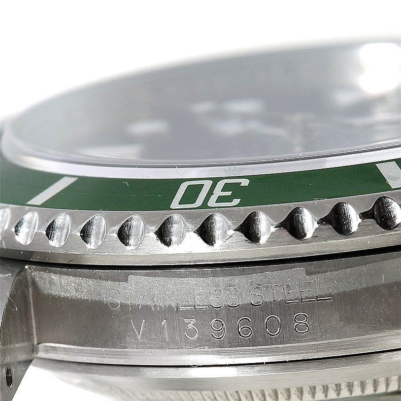 This image shows a close-up of the bezel, crystal, and partial case of a Rolex Submariner 16610 Men
s Stainless Steel Black Dial 16610 Men
s Stainless Steel Black Dial watch.
