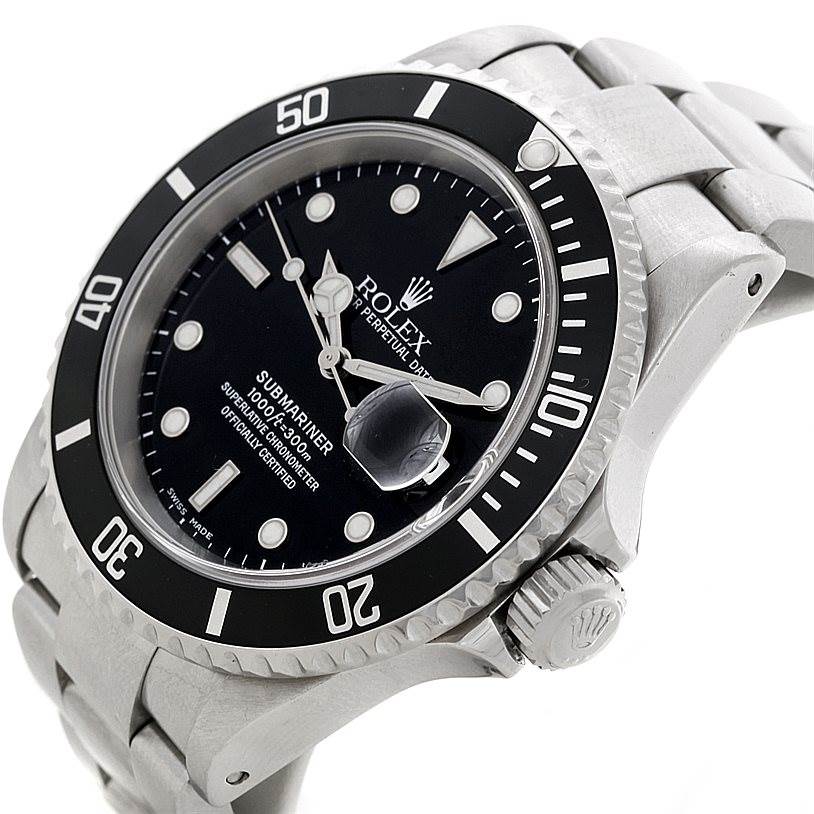 The image shows a side-angle view of a Rolex Submariner 16610 Men
s Stainless Steel Black Dial 16610 Men
s Stainless Steel Black Dial, including the dial, bezel, crown, and part of the bracelet.