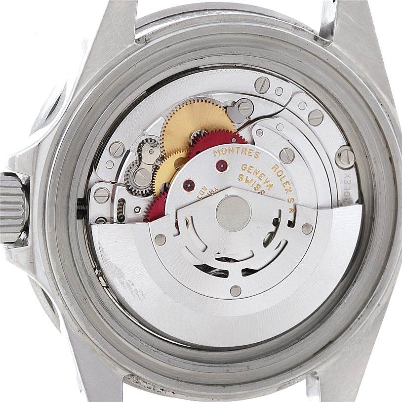 This is an image of the movement mechanism inside a Rolex Submariner 16610 Men
s Stainless Steel Black Dial 16610 Men
s Stainless Steel Black Dial watch, focusing on the gears and rotor.