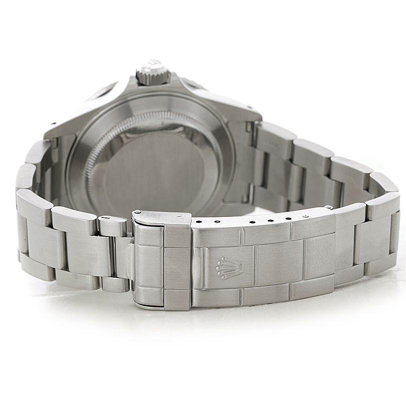 The image shows the back of a Rolex Submariner 16610 Men
s Stainless Steel Black Dial 16610 Men
s Stainless Steel Black Dial watch, highlighting its clasp, bracelet, and case back.