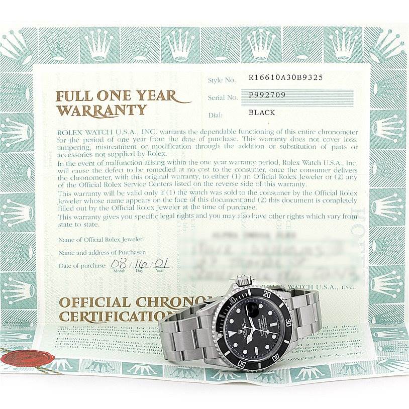 The image shows a Rolex Submariner 16610 Men
s Stainless Steel Black Dial 16610 Men
s Stainless Steel Black Dial watch with its warranty certificate, displaying the watch from the front.