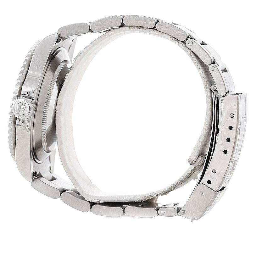 The image shows a side view of a Rolex Submariner 16610 Men
s Stainless Steel Black Dial 16610 Men
s Stainless Steel Black Dial, highlighting the crown and metal bracelet.