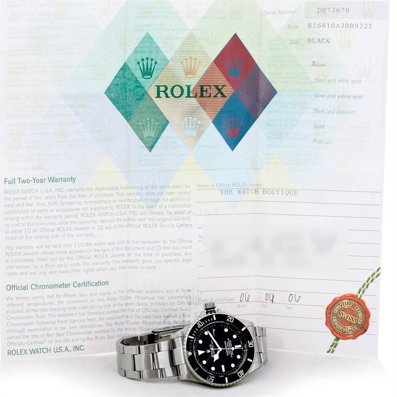 The image shows a Rolex Submariner 16610 Men
s Stainless Steel Black Dial 16610 Men
s Stainless Steel Black Dial watch displayed at an angle on its side, with warranty and certification papers behind it.