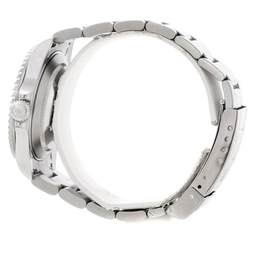 The image shows a side view of a Rolex Submariner 16610 Men
s Stainless Steel Black Dial 16610 Men
s Stainless Steel Black Dial watch, focusing on the case, crown, and bracelet.