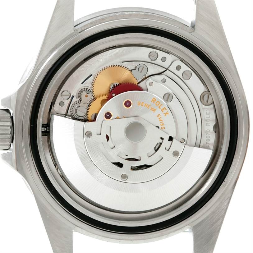 This image shows the inner mechanics and movement of a Rolex Submariner 16610 Men
s Stainless Steel Black Dial 16610 Men
s Stainless Steel Black Dial watch, viewed from the back with its case removed.