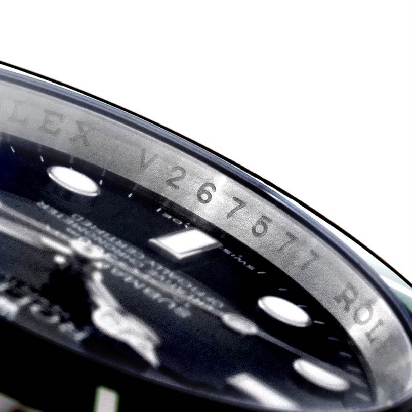 The image shows a close-up of the dial and chapter ring of a Rolex Submariner 16610 Men
s Stainless Steel Black Dial 16610 Men
s Stainless Steel Black Dial watch.
