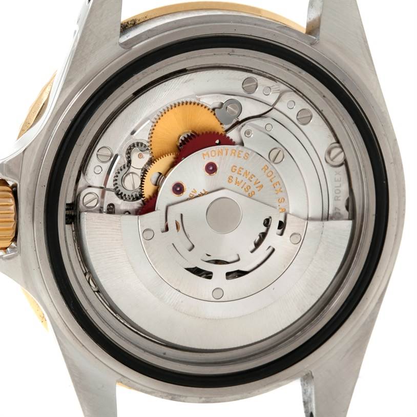 The image shows the back view of a Rolex Submariner 16613 Men's Steel and Gold (two tone) Blue Dial 16613 Men's Steel and Gold (two tone) Blue Dial, revealing its movement and internal components.