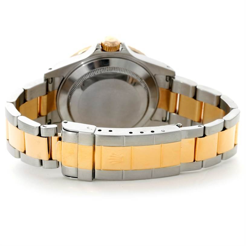 This image shows the back and bracelet of a Rolex Submariner 16613 Men's Steel and Gold (two tone) Blue Dial 16613 Men's Steel and Gold (two tone) Blue Dial watch, highlighting its two-tone metal design.