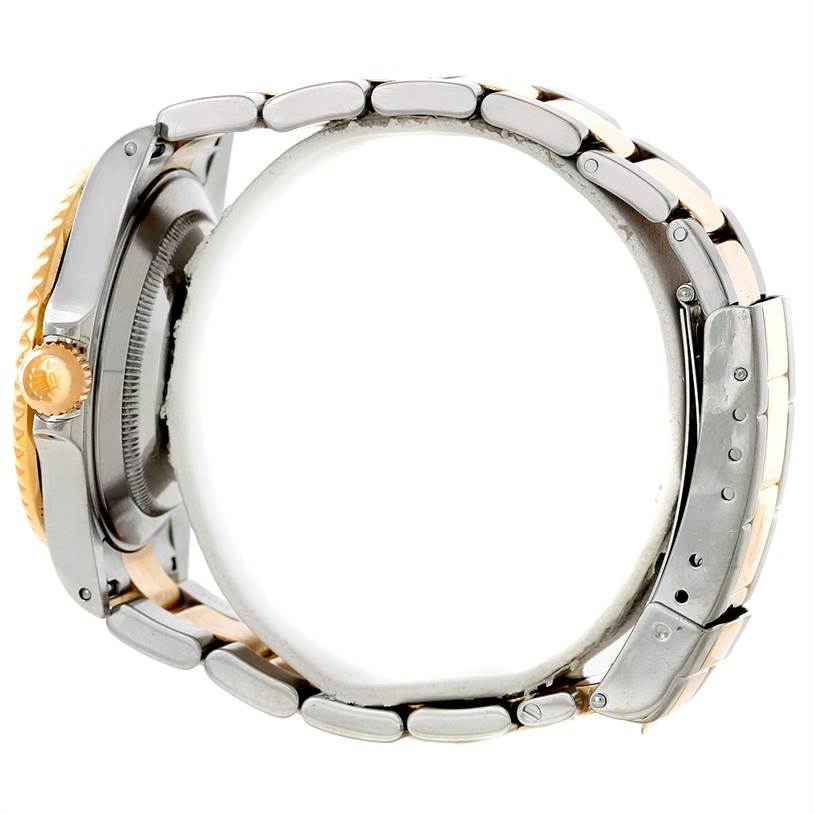 Side view of the Rolex Submariner 16613 Men's Steel and Gold (two tone) Blue Dial 16613 Men's Steel and Gold (two tone) Blue Dial, showing the case, crown, and part of the bracelet.