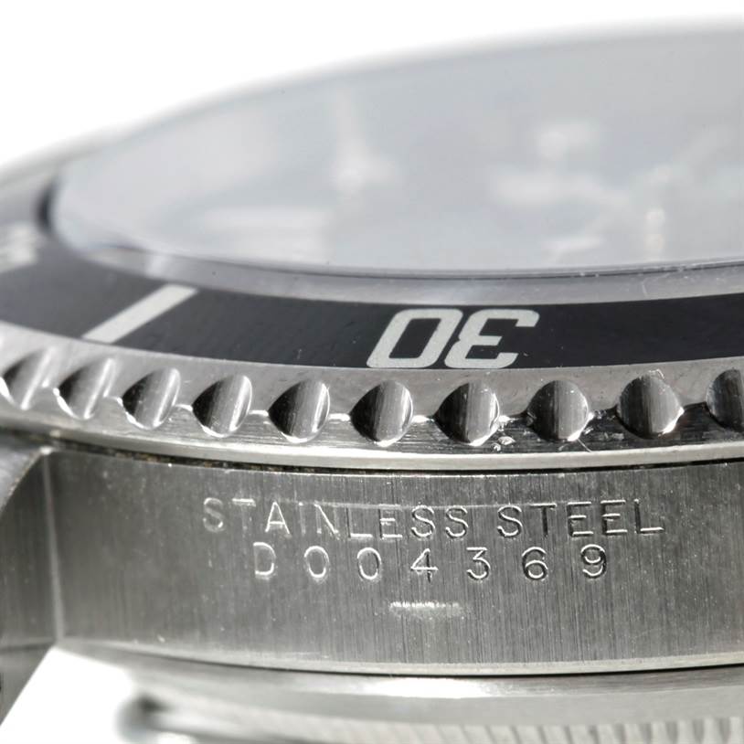 The close-up angle shows the bezel and part of the case of the Rolex Submariner 14060 Men
s Stainless Steel Black Dial 14060 Men
s Stainless Steel Black Dial, highlighting the "30" marker and "STAINLESS STEEL" engraving.