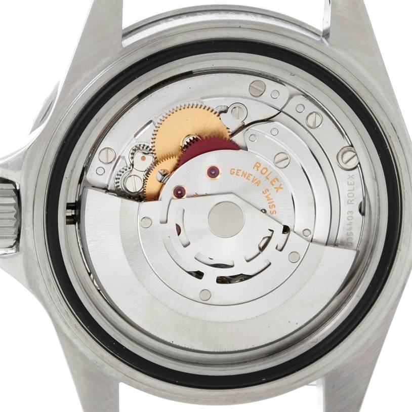 This image shows the internal mechanism of a Rolex Submariner 14060 Men
s Stainless Steel Black Dial 14060 Men
s Stainless Steel Black Dial watch from the back, displaying its gears and movement parts.