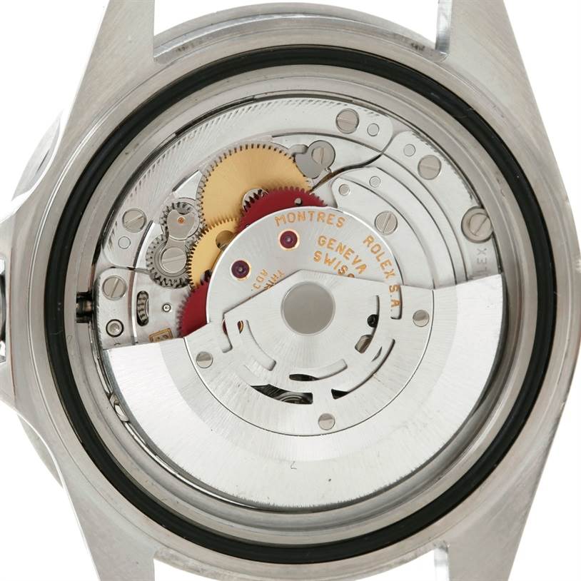 This image shows the Rolex Submariner 16610 Men
s Stainless Steel Black Dial 16610 Men
s Stainless Steel Black Dial watch from the back, revealing the internal mechanical movement and components.