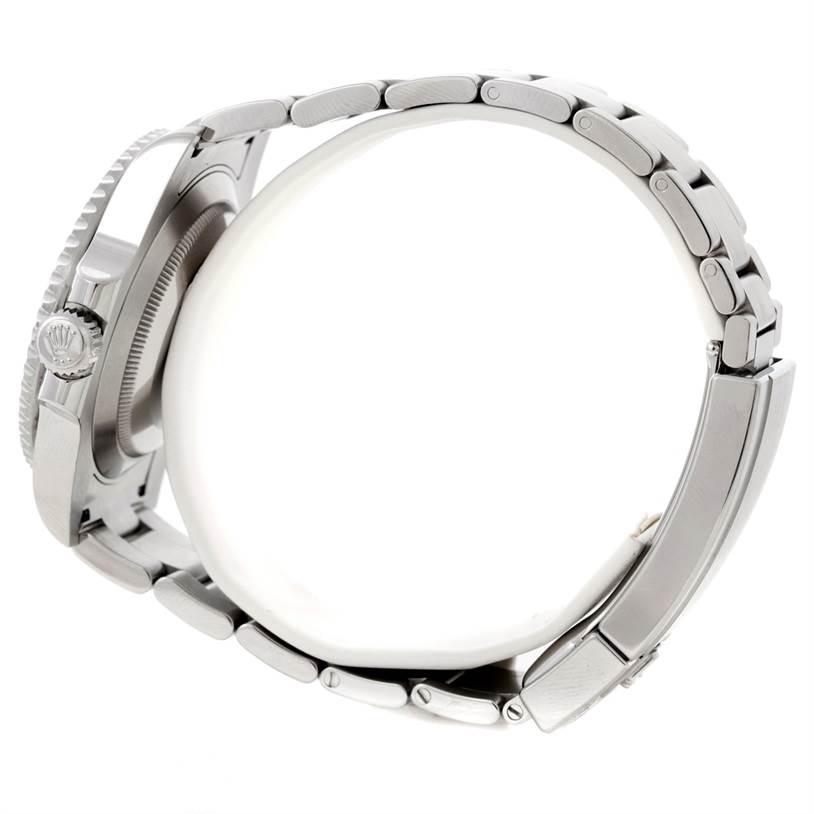 The image shows a Rolex Submariner 114060 Men
s Stainless Steel Black Dial 114060 Men
s Stainless Steel Black Dial watch viewed from the side, highlighting the crown, case, and bracelet.