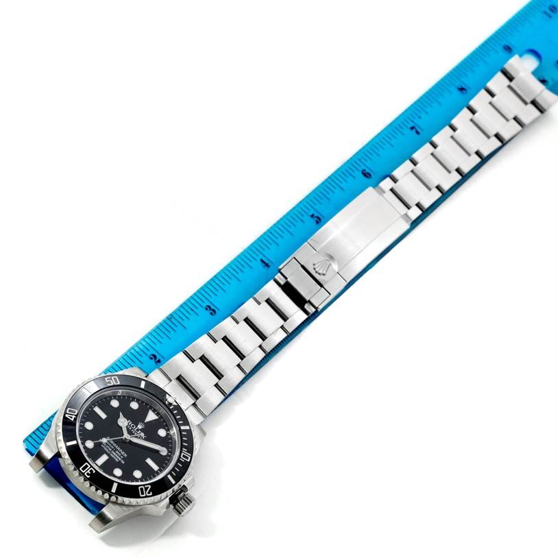 The image shows a top-down view of a Rolex Submariner 114060 Men
s Stainless Steel Black Dial 114060 Men
s Stainless Steel Black Dial watch, including its dial, bezel, stainless steel bracelet, and clasp.