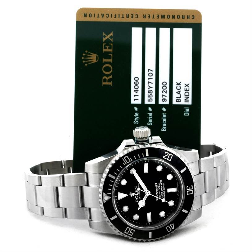 The image shows a Rolex Submariner 114060 Men
s Stainless Steel Black Dial 114060 Men
s Stainless Steel Black Dial watch face and band at a front angle, alongside its certification card.