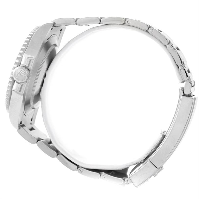 The image depicts a side view of the Rolex Submariner 114060 Men
s Stainless Steel Black Dial 114060 Men
s Stainless Steel Black Dial, showcasing its metal bracelet and crown with the case partially visible.