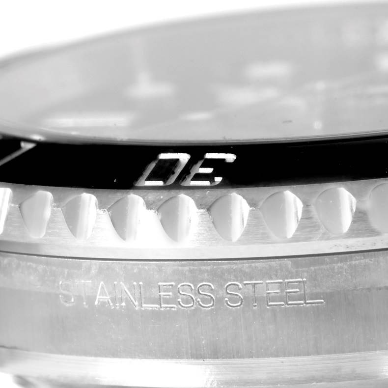 The image shows a close-up of the bezel and stainless steel case of a Rolex Submariner 114060 Men
s Stainless Steel Black Dial 114060 Men
s Stainless Steel Black Dial watch.