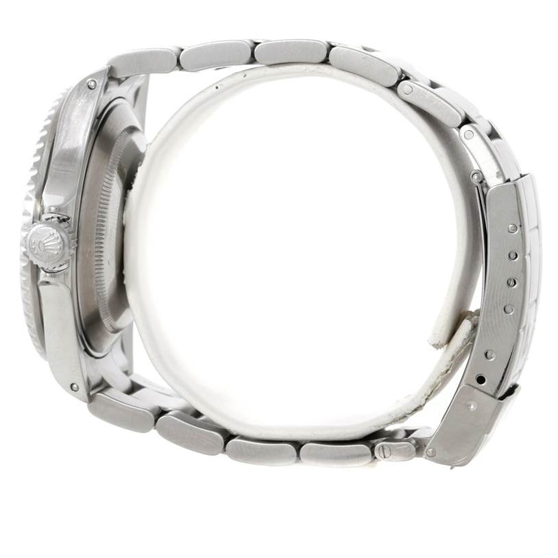 The image shows a side view of a Rolex Submariner 16610 Men
s Stainless Steel Black Dial 16610 Men
s Stainless Steel Black Dial watch, focusing on the stainless steel bracelet and case.