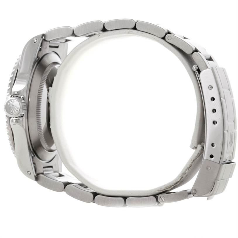 The image shows a side view of a Rolex Submariner 14060 Men
s Stainless Steel Black Dial 14060 Men
s Stainless Steel Black Dial, highlighting the bracelet, clasp, and crown.