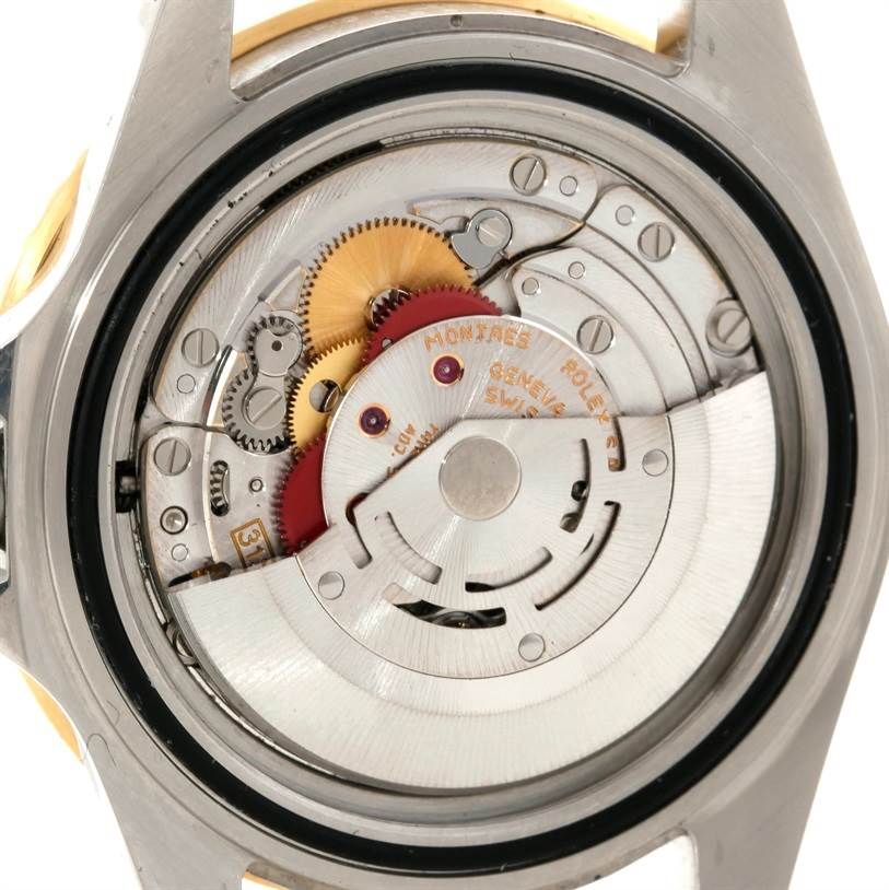 The image shows the caseback of the Rolex Submariner 16613 Men's Steel and Gold (two tone) Blue Dial 16613 Men's Steel and Gold (two tone) Blue Dial, displaying its intricate mechanical movement.