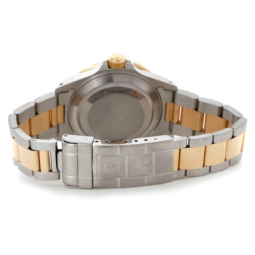 The image shows the back view and clasp of a Rolex Submariner 16613 Men's Steel and Gold (two tone) Blue Dial 16613 Men's Steel and Gold (two tone) Blue Dial watch, highlighting the case and two-tone bracelet.