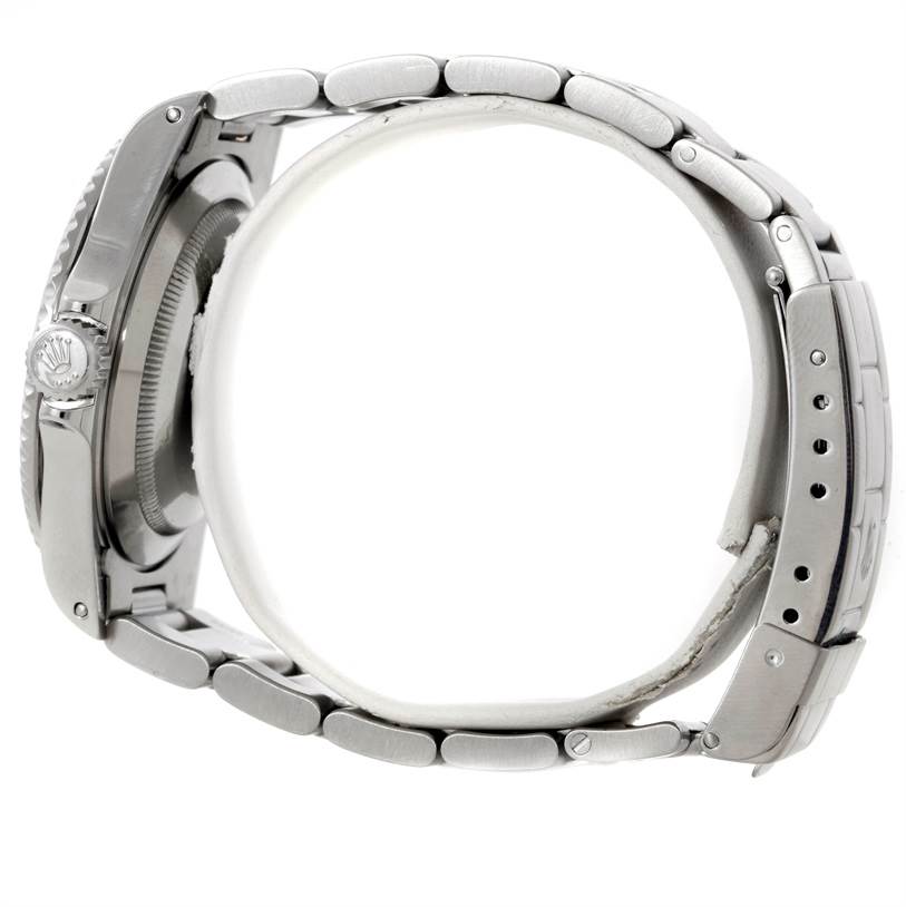 This image shows a side view of a Rolex Submariner 14060 Men
s Stainless Steel Black Dial 14060 Men
s Stainless Steel Black Dial watch, highlighting the bracelet links, crown, and part of the clasp.