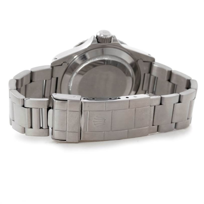 The image shows the back of the Rolex Submariner 14060 Men
s Stainless Steel Black Dial 14060 Men
s Stainless Steel Black Dial watch and its metal bracelet clasp.