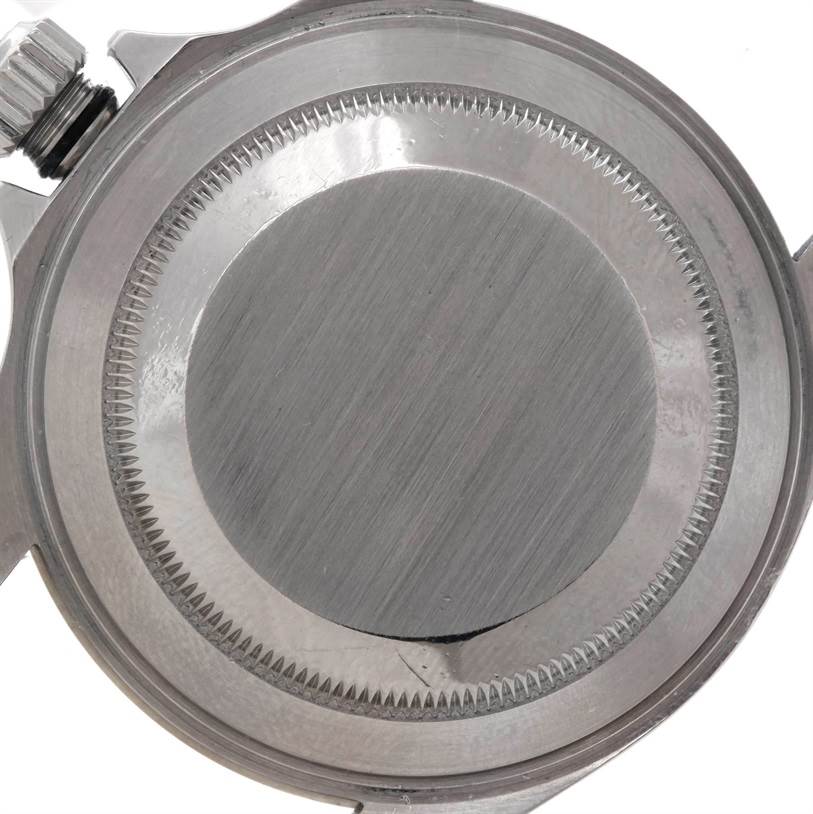 This image shows the back case and crown of a Rolex Submariner 14060 Men
s Stainless Steel Black Dial 14060 Men
s Stainless Steel Black Dial watch from a top-down angle.