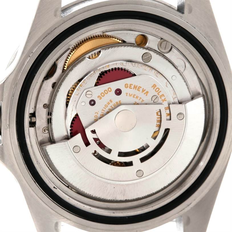 The image shows the backside, revealing the intricate mechanism of the Rolex Submariner 14060 Men
s Stainless Steel Black Dial 14060 Men
s Stainless Steel Black Dial watch model.